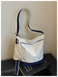 Stylish navy blue and white canvas tote bag with a matching small hanging pouch