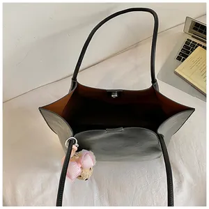 Elegant large capacity commuter tote bag for women with magnetic closure and charm