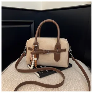 Vintage suede pillow bag with brown leather straps and beaded tassel detail