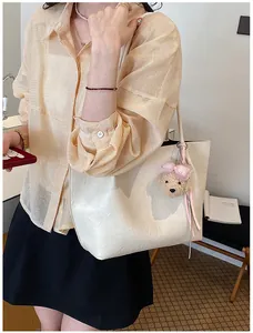 Elegant cream-colored large tote bag for women, perfect for stylish office commuting.