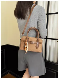Retro brown suede pillow bag with wooden bead charm for women's daily commute style