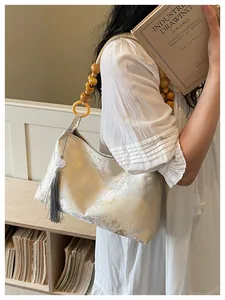 Elegant New Chinese style shoulder bag with wooden bead handle and silk tassel detail