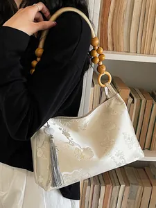 Elegant New Chinese style jacquard shoulder bag with wooden bead handle and tassel