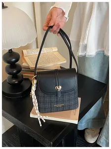 Trendy plaid crossbody bucket bag for women, perfect for stylish daily commuting.