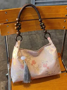 Elegant Neo-Chinese style handbag with floral jacquard and wooden bead handles.