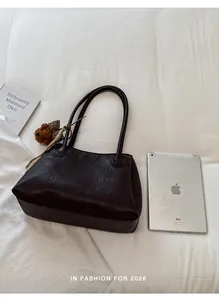Retro dark brown Maillard tote bag shown with an iPad to demonstrate large capacity.