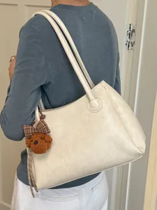 Premium vintage commuter tote bag with large capacity and cute teddy bear charm for daily use