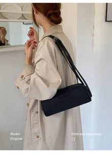 Elegant vintage black nylon underarm bag with double slim shoulder straps for women.