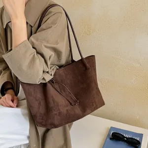 Large capacity retro brown suede tote bag for women showing a stylish commuter look