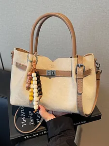 Vintage beige suede tote bag with beaded charm and brown leather straps