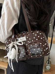 Vintage style brown polka dot underarm shoulder bag featuring clear front pockets
