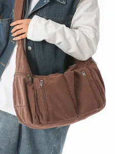 Große braune Canvas-Umhängetasche mit vielen Taschen für Damen, ideal für das Studium.