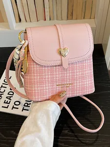 Trendy pink plaid crossbody bag for women with heart clasp and decorative charms