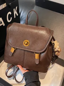 Minimalist vintage brown soft leather backpack for women with gold-tone hardware
