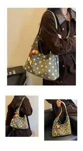 Detail view of retro suede polka dot tote bag with colorful decorative charms