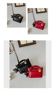 Detail view showing black and red faux leather handbags with unique circular handles.