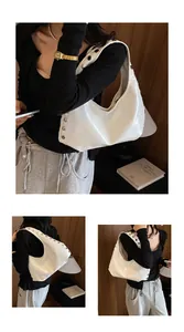 White vintage rivet underarm dumpling bag showing different perspectives on a model