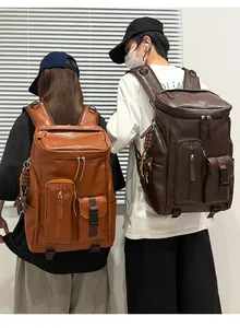 Two models wearing large retro PU leather backpacks in tan and dark brown colors.