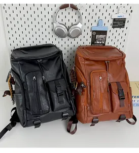 Detailed view of black and brown vintage leather backpacks with functional pockets