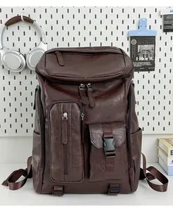 Detailed front view of a vintage brown PU leather commuter backpack with multi-pockets