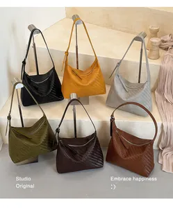 Detail showing the six color options and woven texture of the shoulder bag collection