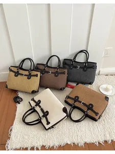 Five colors of women's canvas tote bags with leather trim and buckles for daily use.