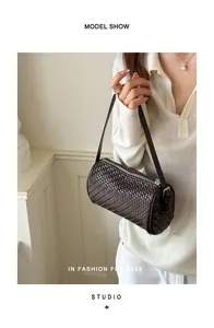 Chic vintage dark brown woven barrel shoulder bag for women in elegant studio setting