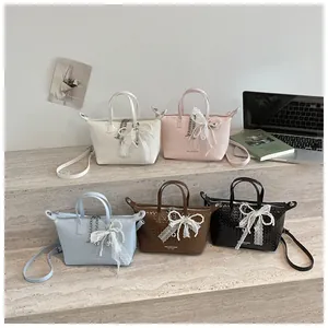 Detailed view of retro versatile tote bag in five elegant colors with lace pearl bows
