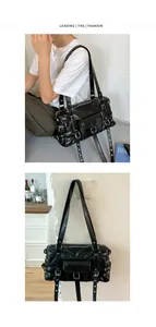 Chic black rivet underarm bag for women, stylish commuter shoulder bag with buckle straps