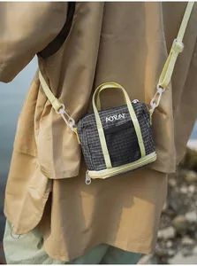 Compact women's casual mini crossbody bag with pale yellow straps and grid pattern