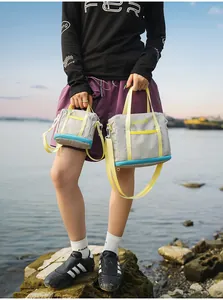 Outdoor lifestyle view of the gray lightweight fabric tote bags in two different sizes.