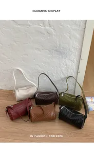 Group of retro woven texture barrel bags shown in various fashion colors on wooden floor