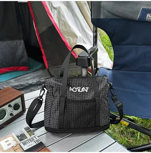 Black checkered casual women's tote bag displayed on a silver outdoor camping table