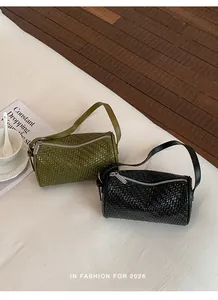 Green and black woven texture barrel bags shown together on a clean white surface