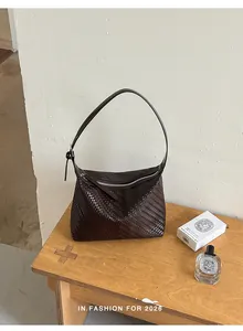 Minimalist dark brown woven underarm bag for women with elegant retro aesthetic design