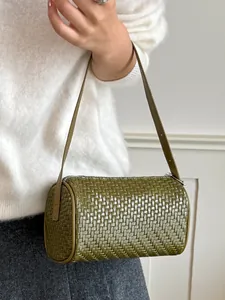 Vintage olive green woven cylindrical underarm bag with elegant single shoulder strap
