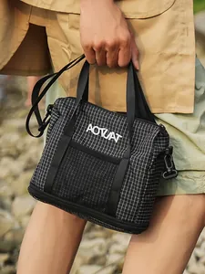 Stylish black and white checkered tote bag for women, lightweight casual fabric handbag.