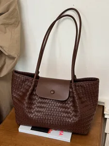 Elegant dark brown woven tote bag with large capacity for women's daily commuting.