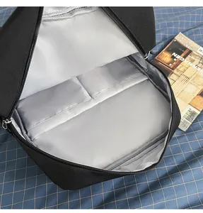 Close-up showing the interior storage pockets and laptop compartment of a black backpack