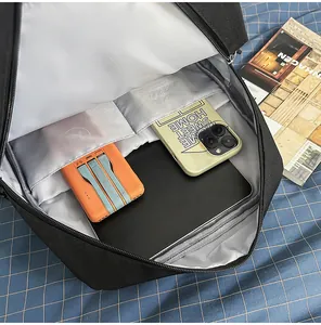 Interior view of stylish black backpack featuring laptop sleeve and organized pockets
