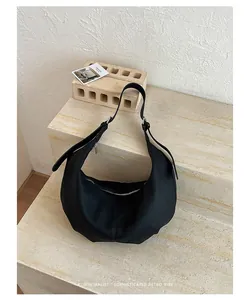 Large black pleated hobo bag with a minimalist retro vibe for women's chic daily commute