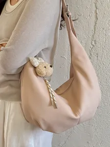 Stylish vintage ruched crescent hobo bag in soft beige leather with cute plush charm