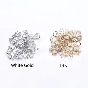 Detailed view of 14K gold and silver four-leaf clover zircon charms for DIY jewelry