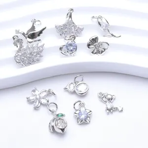 Detailed view of assorted silver-toned pendants with sparkling cubic zirconia