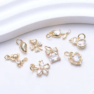 Detailed collection of assorted 14K gold plated charms with white zircons for DIY jewelry