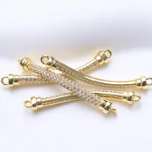Close-up of 18K gold plated zircon curved tube connectors for DIY jewelry creation