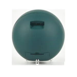 Rear view detail of a dark green spherical automatic watch winder with USB-C charging port