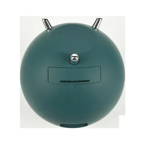 Back view of a spherical dark green automatic watch winder featuring silver decorative accents