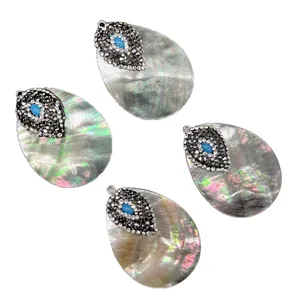 Mooie natuurlijke zwarte schelp druppelhangers met luxe strass en turkoois inleg