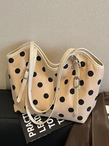 Bolso tote de lona beige vintage con lunares negros y elegantes correas ajustables